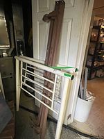 Headboard and rails leaning against wall