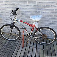 Full side view of bike and pump showing color scheme, frame, wheels, pump placement