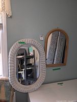 Front view of both mirrors hanging on wall