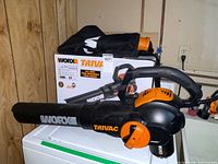 Blower/vac unit with collection bag and box
