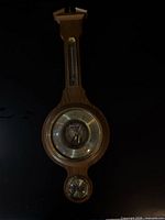 Front view of entire wooden banjo weather station showing all three instruments