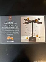 Sealed Brookstone Ring Toss Drinking Game retail box showing product image and contents