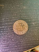 Reverse side showing denomination and date