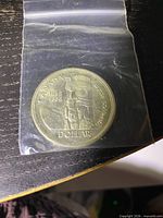 Reverse showing totem pole design, dates 1858 1958 and denomination
