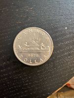 Reverse showing voyageur canoe design, date and denomination
