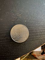 Reverse of 1982 Constitution dollar showing "1867 Confederation / Constitution 1982" design