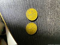 Obverse side of both 1943 Canada 5-cent coins