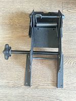 Front view showing full bracket assembly, knob and spring latch