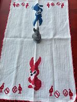 Full view of table runner with figurine placed on top