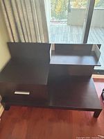 Full view of bedside table showing stepped design and color