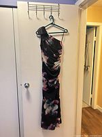 Full view of dress hanging to show overall design and length