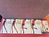 All five sealed pantyhose packages laid out front view