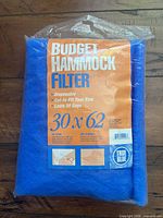 Front of sealed package showing Budget Hammock Filter branding, size 30 x 62 in, features