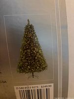 Box showing full image of lit artificial tree