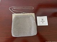 Front view of silver mesh evening bag with sterling chain