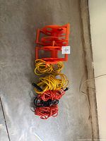 all cords coiled with two orange cord reels