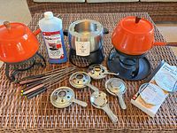 Full lot overview showing three pots, forks, fuel, burner parts