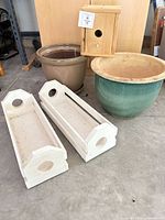 Group shot of two pottery pots, two window boxes and birdhouse