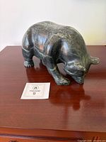 Full view of stone bear on tabletop