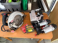 Lot overview: Skil circular saw, three Porter-Cable pneumatic tools, two Arrow staple boxes