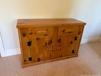 Front view of buffet showing drawers, cabinet doors, hardware and overall appearance