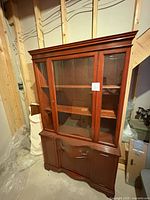 Full view of china cabinet front, showing glass hutch and lower storage