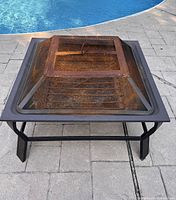 Full view of fire pit with mesh spark screen in place