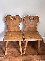 Front view of both solid oak accent chairs