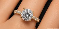 Top view showing round brilliant lab diamond with accent stones