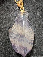 Front view of carved turtle pendant