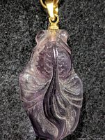 Front view of carved carnelian turtle pendant showing overall shape and bail