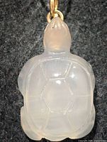 Front view carved carnelian turtle pendant