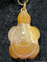 Front view of carnelian turtle figurine pendant