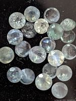 Close view of loose faceted alexandrite stones showing colour and cut