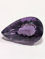 Front view of faceted pear-shaped amethyst gemstone