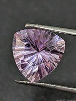Front view of faceted trillion-cut light purple amethyst
