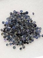 Close view of loose round blue sapphires