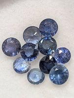 Ten round blue sapphires in various blue tones
