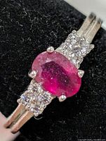 Front view of ring showing ruby and CZ accent stones