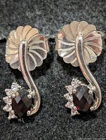Front view showing fan design, garnet and CZ accents