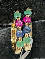 front view of both gemstone hoops showing stone colors and setting