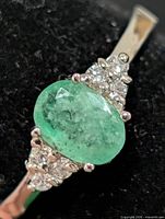 Close-up of emerald and accent stones