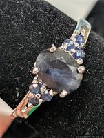 Top view of ring showing center sapphire and side stones