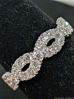 Front view of the silver ring showing the pave CZ infinity motif