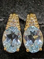 Front view showing both earrings, gemstones and CZ accents