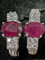 Front view showing rubies and CZ accents on both earrings