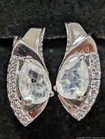 Front view of both earrings showing moonstones and accent stones