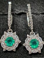 front view of both earrings showing green onyx centres, CZ halo and pavé hoops