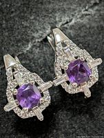front view of both earrings showing amethyst centres and CZ halo