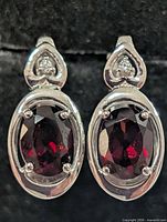 front view showing garnet stones and heart accents